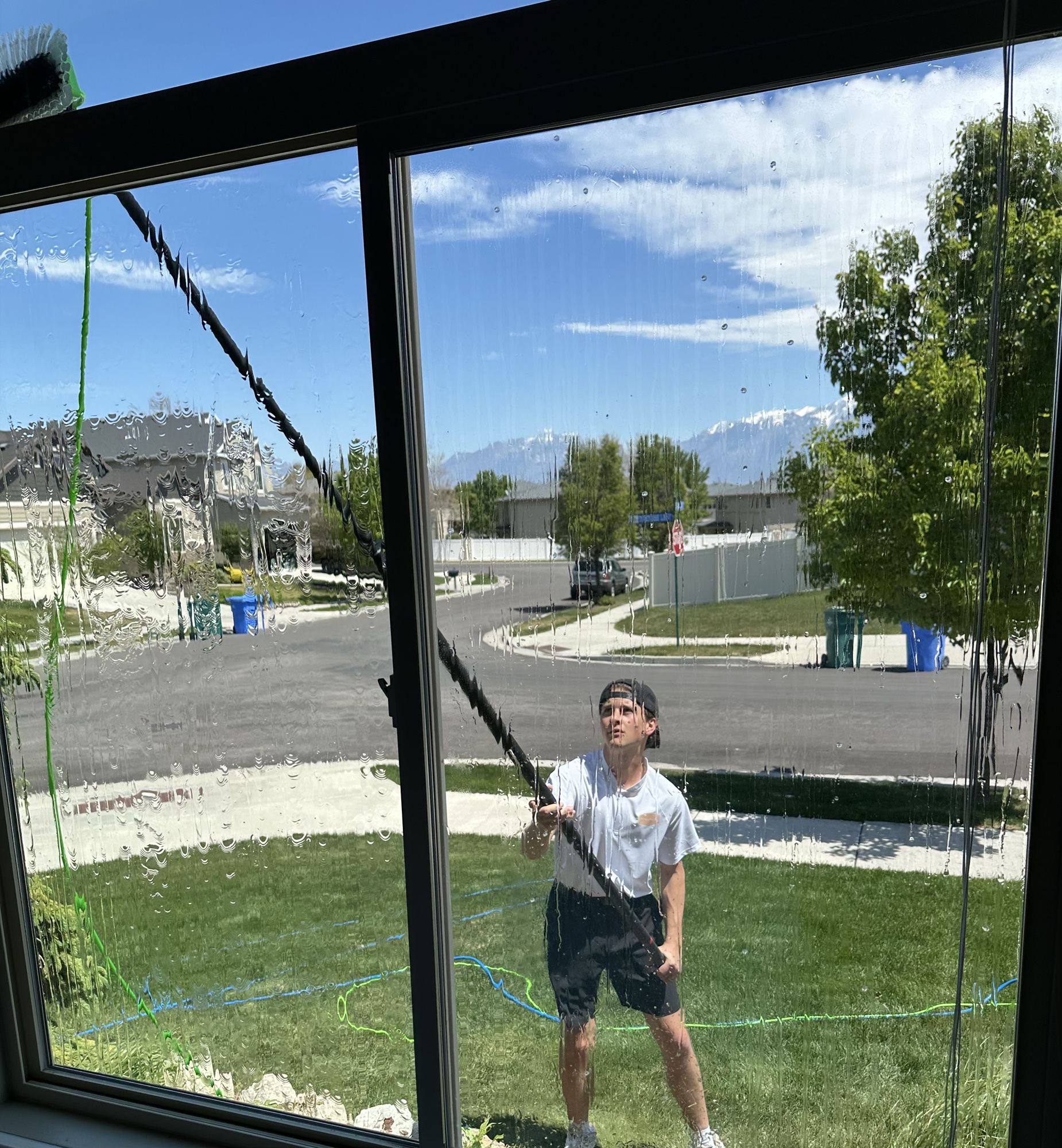 Window cleaning viewed through glass
